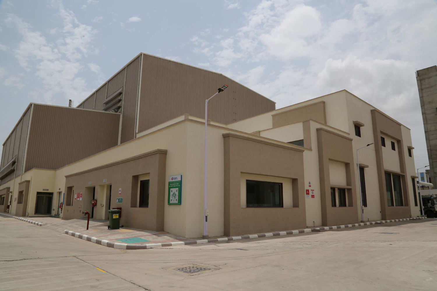 Palm-lined driveway and main office
